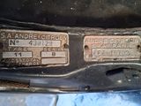 a close up of a car ' s license plate on the front of the car