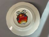 a white plate with a christmas ornament on it