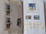 an open book with a picture of a train and stamps on it