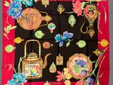 an image of a scarf with a variety of items on it