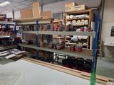 many shelves with various items on them in a room