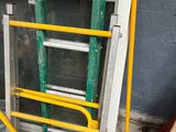 a ladder leaning against the wall next to a window
