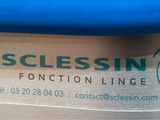 a close up of a label on the side of a blue suitcase