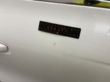 a picture of a sticker on the door of a white car