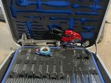 a tool case with tools in it sitting on the ground