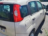a small car that is parked in a parking lot