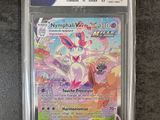 a pokemon card in a plastic case on a table