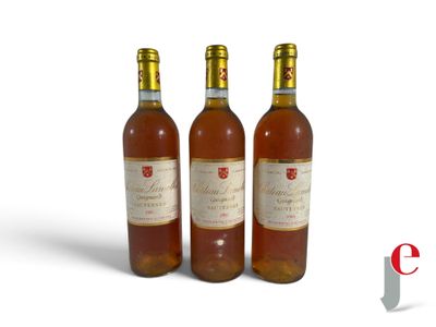 three bottles of wine sitting next to each other on a white surface