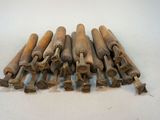 a lot of wooden baseball bats on a white surface
