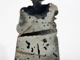 a picture of a piece of metal with a bear on it