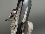 a close up of a gun that is on display in a museum