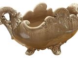 a large bowl that has a ram head on it