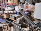 a lot of clutter in a garage with a lot of tools