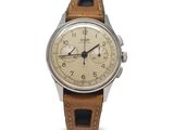 an image of a wrist watch with a brown leather strap