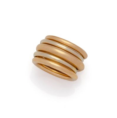 a gold ring with three bands on a white background