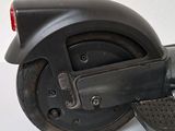 a black scooter that is sitting on a table