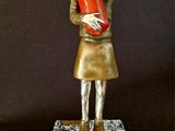statue of a woman holding a lobster in her arms