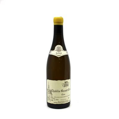 a bottle of wine that is sitting on a table