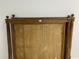 an old wooden cabinet with a mirror on top of it