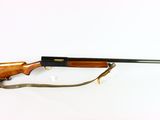 the rifle is laying on a white surface and ready to be used
