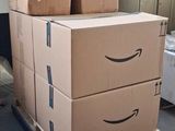 boxes stacked on top of each other on a pallet in a warehouse