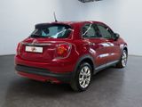 the back of a red fiat suv parked in a showroom
