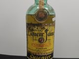 an image of a bottle of liquor sitting on top of a table