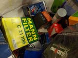 a pile of books and other items in a box
