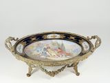 an image of a decorative tray with a painting on it
