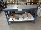 a workbench with tools on it in a warehouse