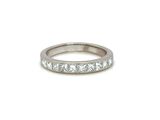 a white gold ring with princess cut diamonds
