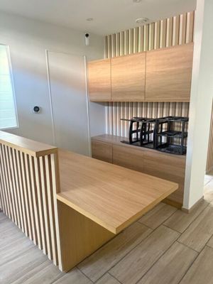 a kitchen with a wooden counter top and wooden cabinets