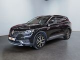a black volkswagen suv parked in a showroom