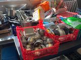 many pots and pans on a table in a kitchen