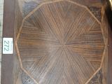 a wooden table with a clock on top of it