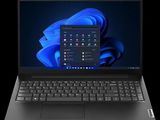the laptop is open on a black background with a blue background