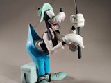 figurine of a man fishing with a fishing pole