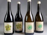 three bottles of wine sitting next to each other on a table