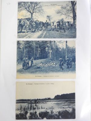 une vieille photo sur laquelle figurent plusieurs personnes et animaux
