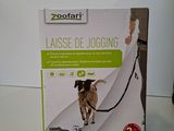 a box with a picture of a dog on a leash
