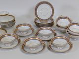 many plates and cups and saucers on the table