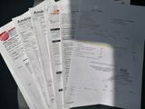 a lot of papers that are sitting on a table