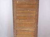 a wooden door that is open on a white floor