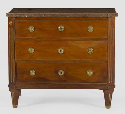an antique chest of drawers with marble top