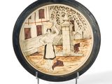 a plate with a picture of a woman and a dog