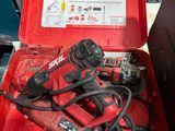 a red tool box with tools in it on a table