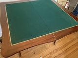 an image of a table with a green cloth on it
