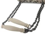 a purse with a chain attached to it