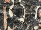 an image of a close up of a wall with a painting on it