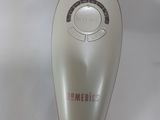a remote control that is sitting on a white surface